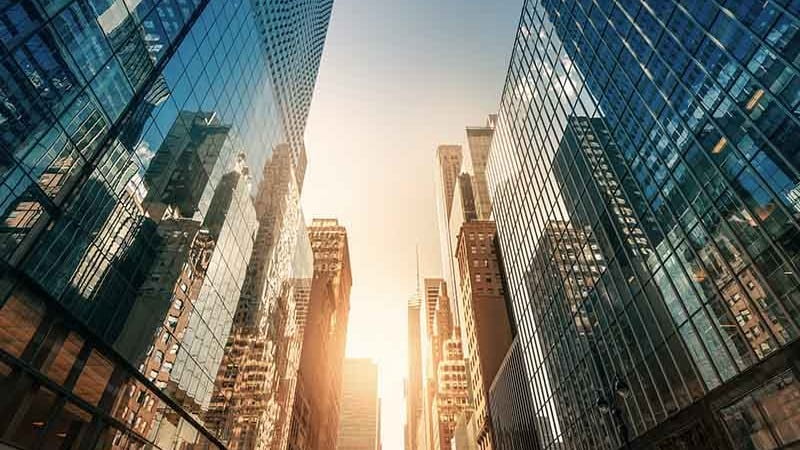 Real estate high rise glass building view from bottom