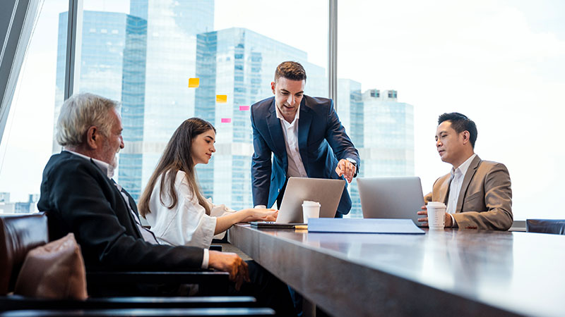 Employees having discussion in meeting room