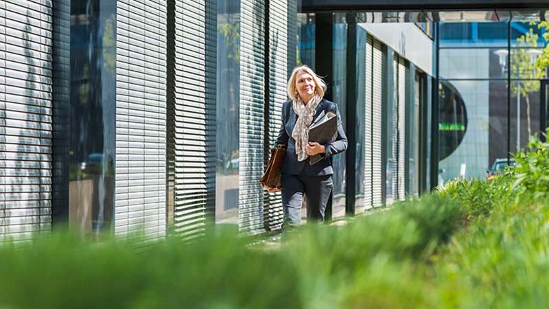 Woman outside a sustainable building