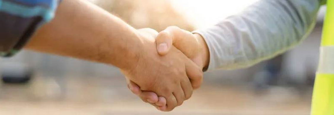 Two people shaking their hands