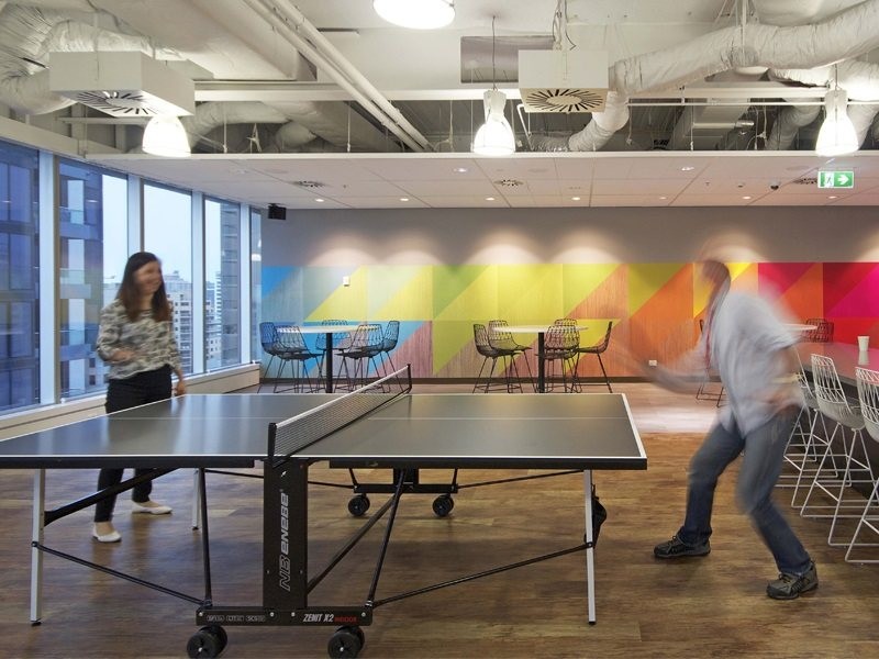 employees playing table tennis