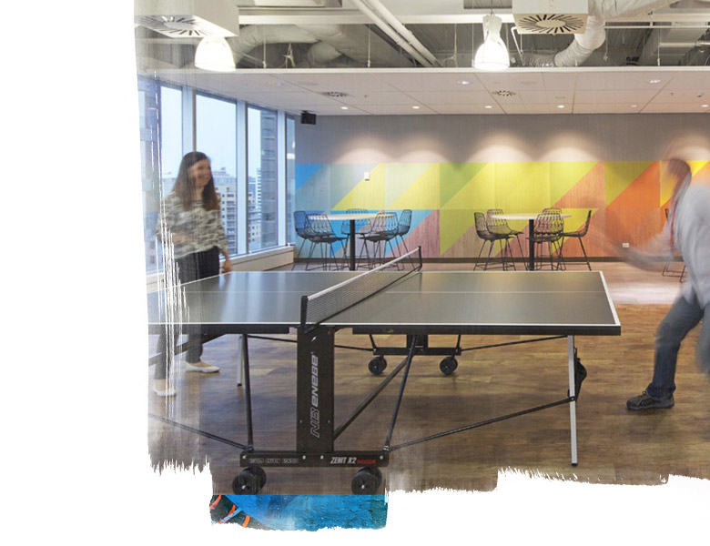 employees playing table tennis