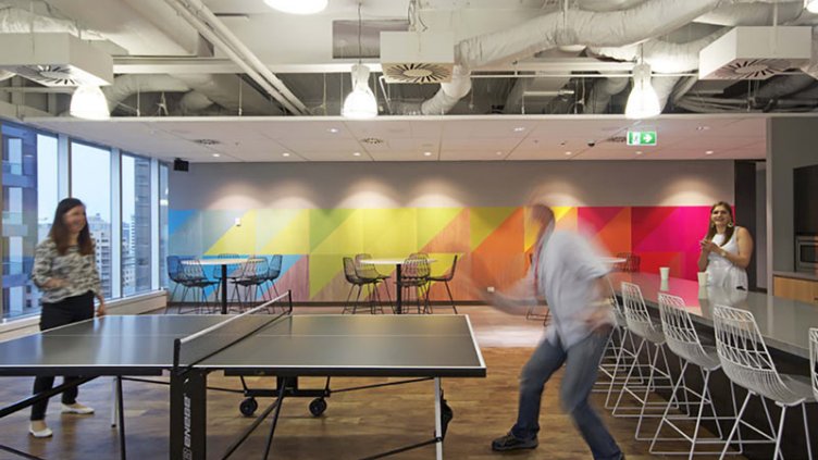 Two people playing table tennis