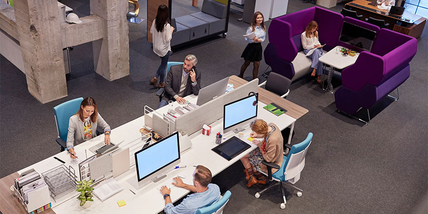 Office employees using different spaces to suit their style of work.