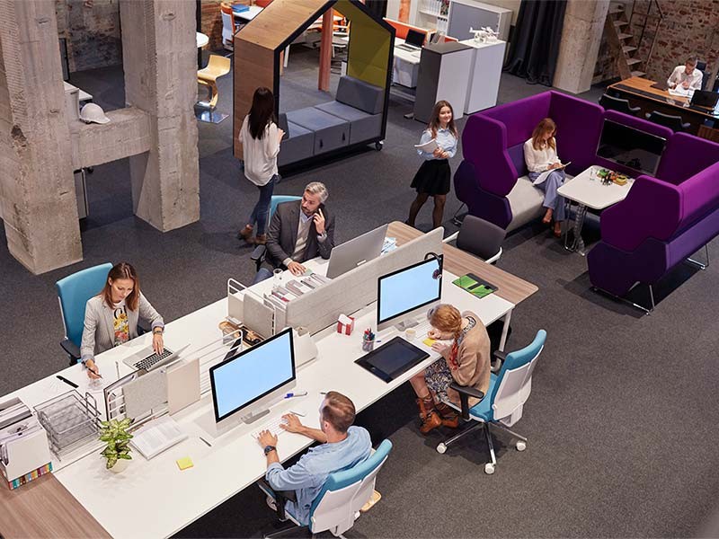 Office employees using different spaces to suit their style of work.