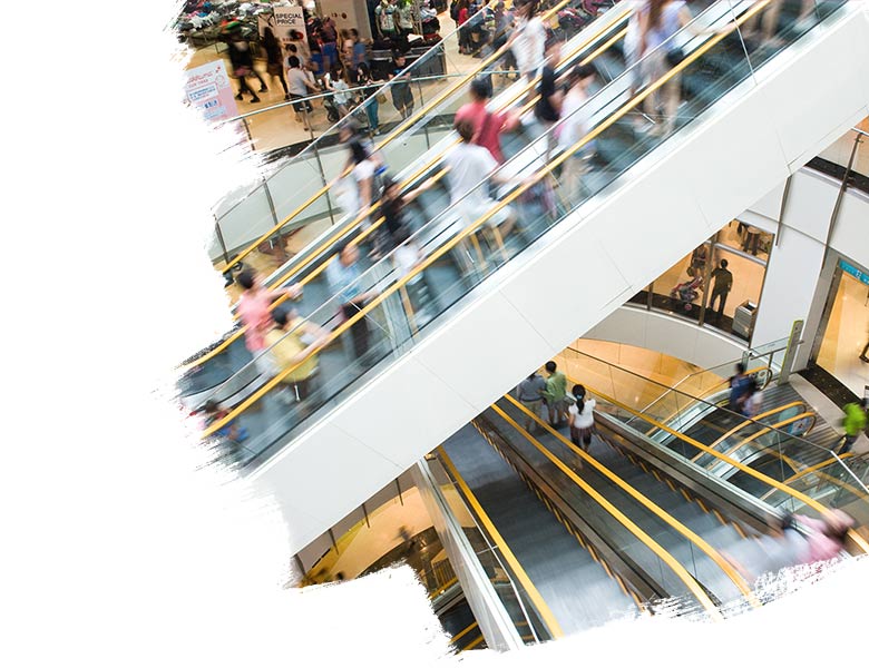 People in motion in escalators at the modern shopping mall