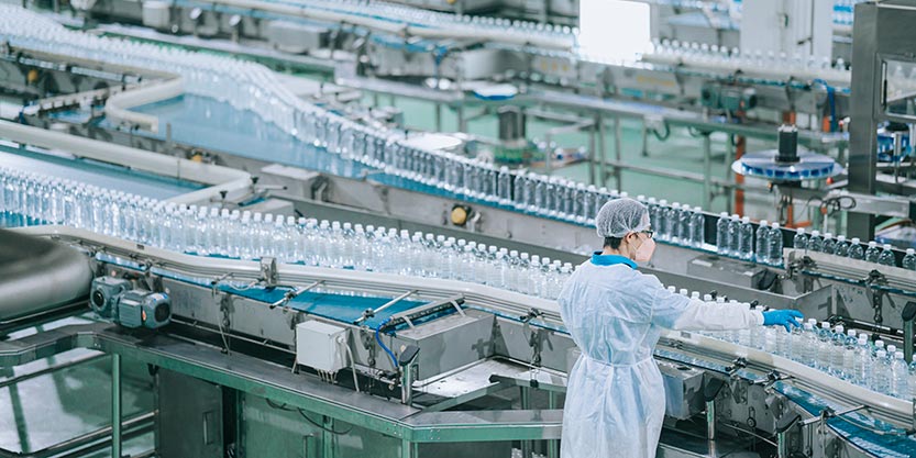 Employee working on a waterball manufacturing unit