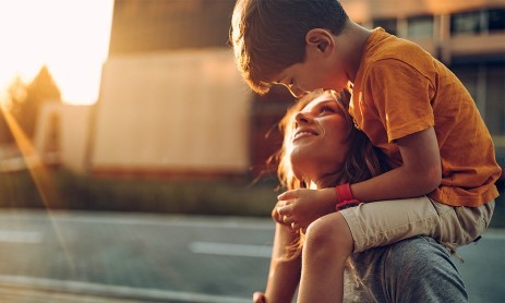 A woman is talking to a boy