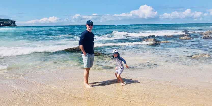 Father and his children having fun at the beach