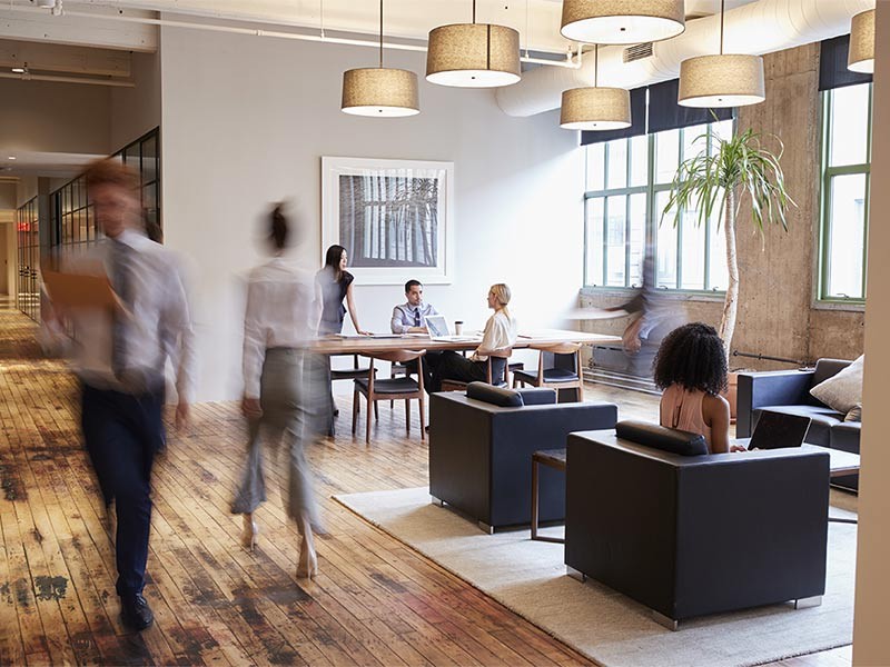 Business people at work in a busy luxury office space