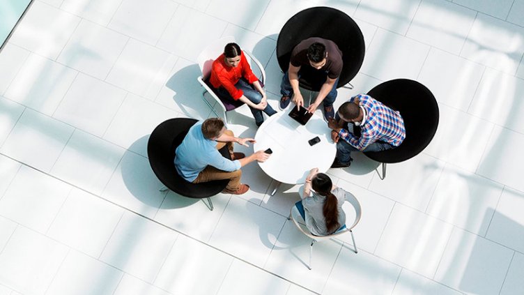 Group of professionals together and discussing