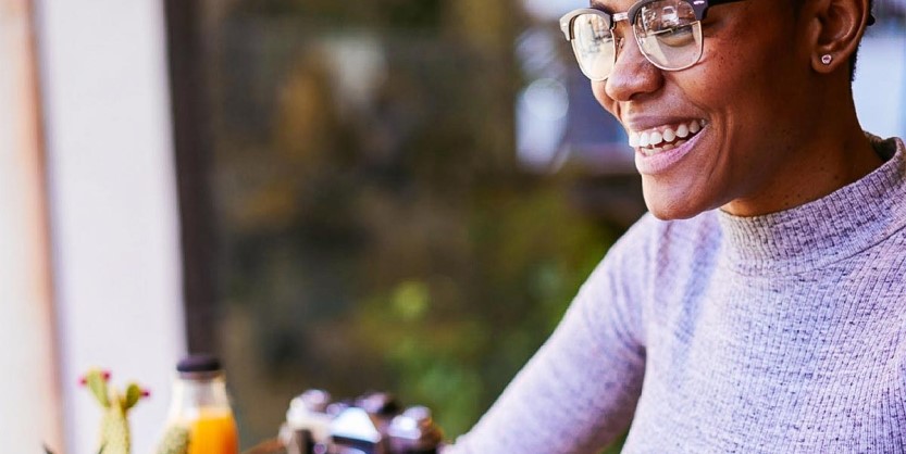 Smiling woman working on laptop